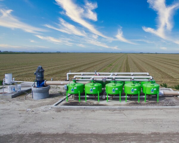 Drip irrigation station for alfalfa crop